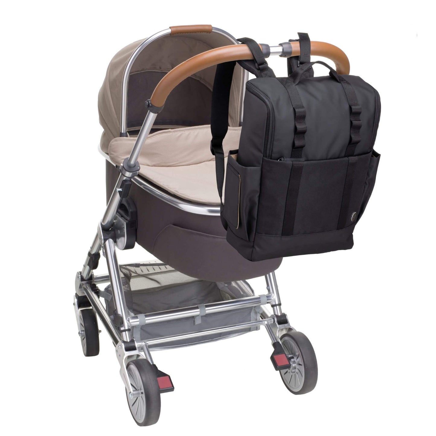 Babymel Finn Changing Backpack in Black attached to a pram using stroller straps, demonstrating its hands-free convenience and practicality for parents on the go.