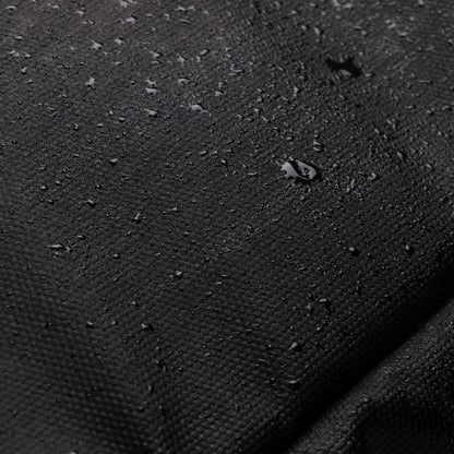 Detailed view of the water-resistant fabric on the Babymel Finn Changing Backpack in Black, demonstrating its durability and ability to repel water effectively.