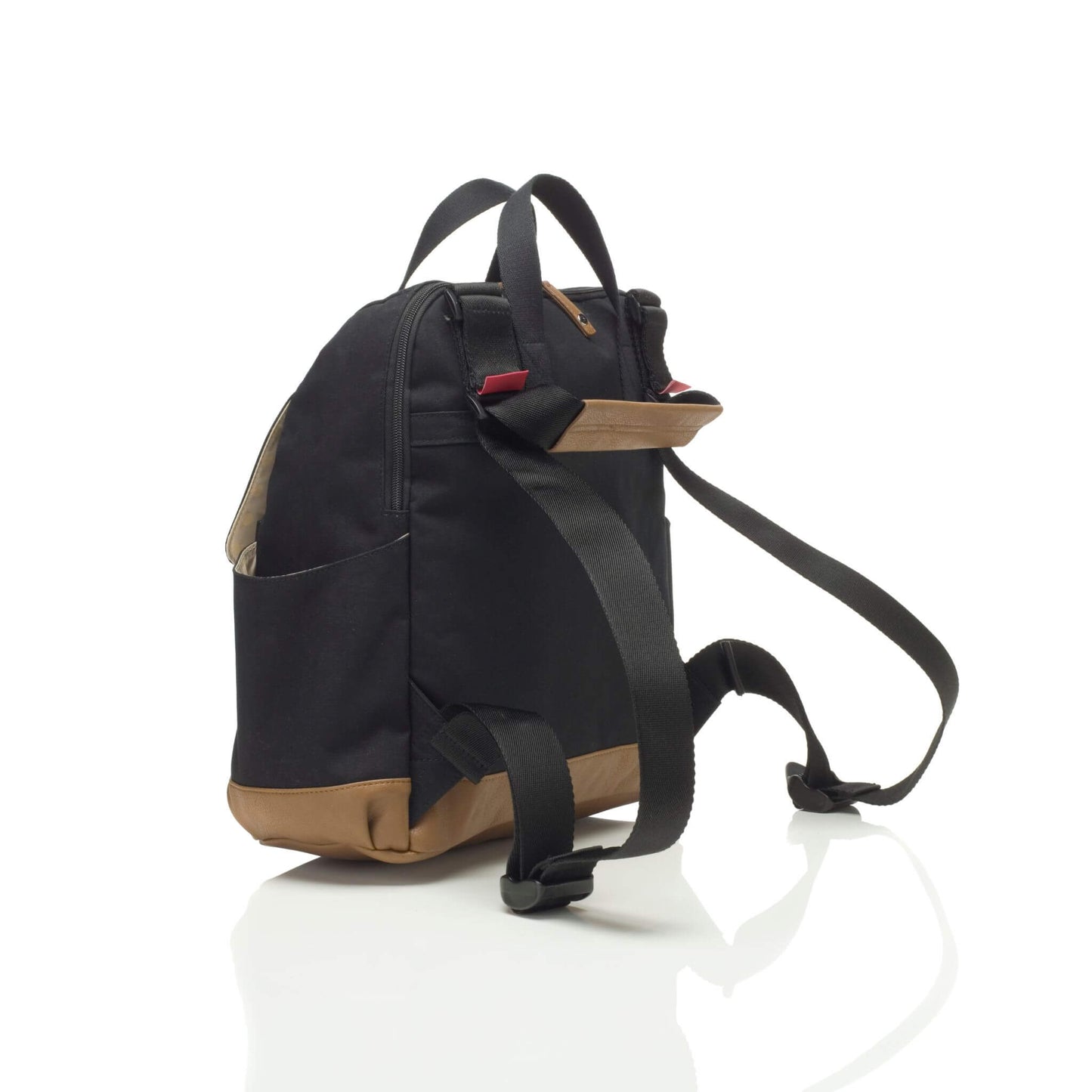 Black Babymel Robyn Eco Convertible Backpack with tan details, shown from a side angle with adjustable backpack straps and luggage sleeve.