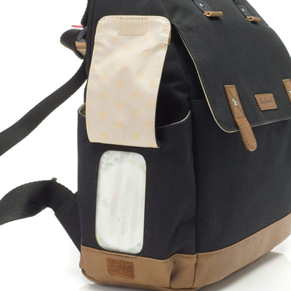 Close-up of the black Babymel Robyn Eco Convertible Backpack with tan details, highlighting the easy-wipes side pocket with a dispenser slot.