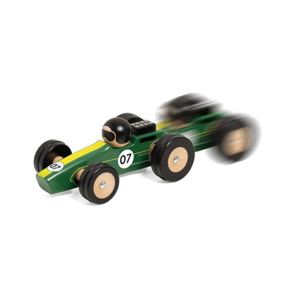 Classic World Silverstone Car in green and yellow, shown in motion with a blur effect, highlighting its sleek design and racing fun.