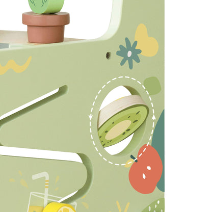 Close-up of the Classic World Kitchen Walker side detail, showcasing a spinning kiwi wheel and vibrant food-themed illustrations for interactive play.