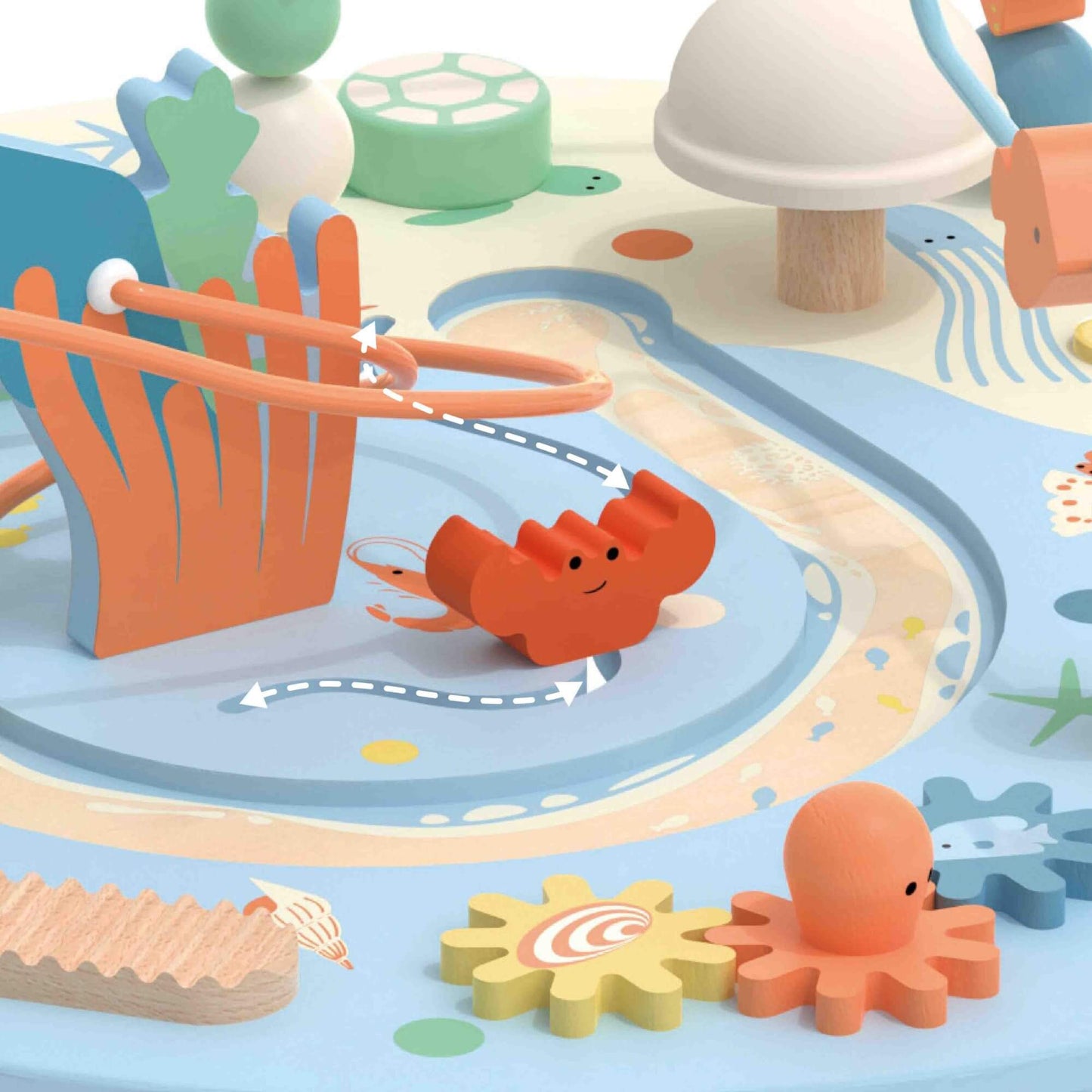 Close-up of the Classic World Multi-Activity Table’s ocean-themed details, featuring a smiling crab, octopus gear, and bead maze paths.