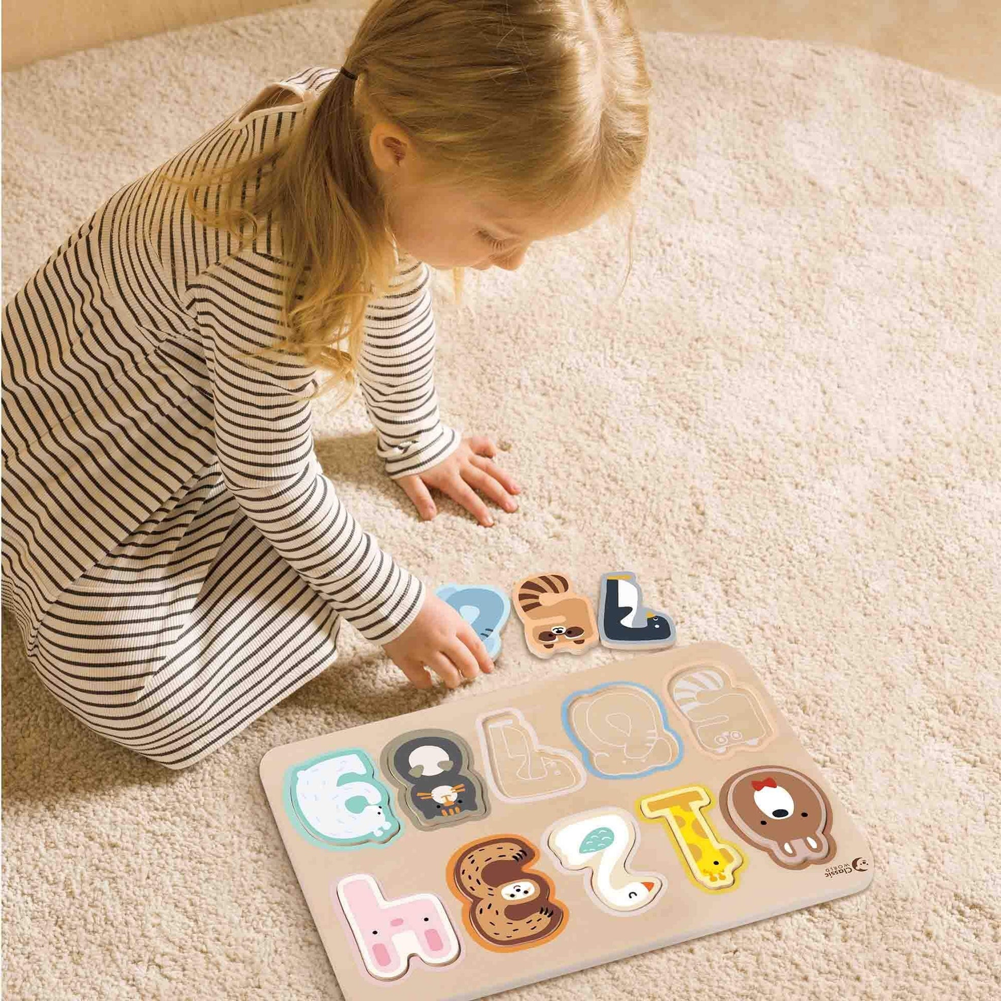 A child playing with the Classic World Number Puzzle, featuring animal-themed wooden pieces for learning numbers 1–10 through hands-on fun.