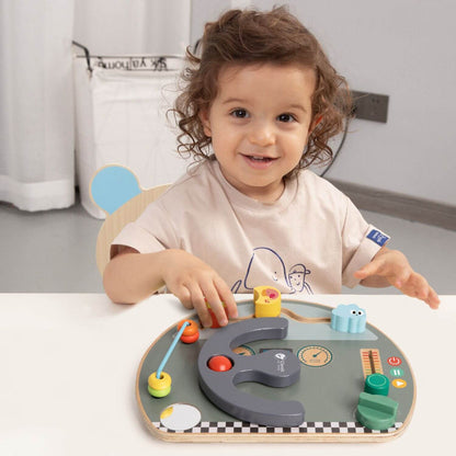 Child playing with the Classic World Travel Busy Board, enjoying its interactive features like the steering wheel and bead slider.