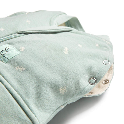 Close-up of ErgoPouch Winter 2.5 tog cocoon swaddle bag in sage, showing snap buttons and zip detail, made from organic, breathable fabric.