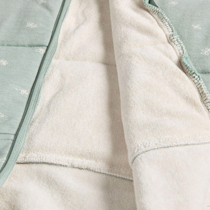 Close-up of the interior fabric of the ErgoPouch Winter 2.5 tog cocoon swaddle bag in sage, featuring soft, organic material for breathable winter warmth.