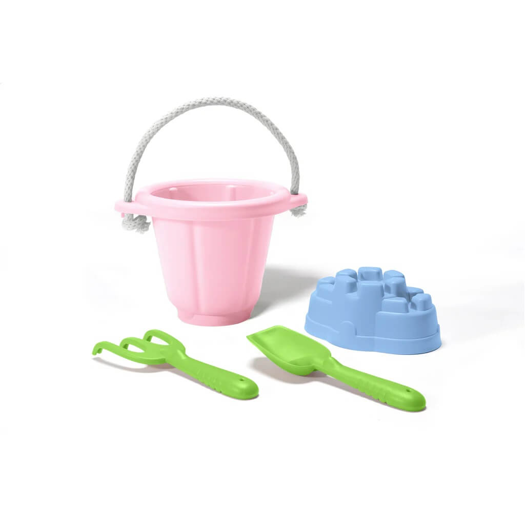 The Green Toys Sand Play Set, made from 100% recycled plastic, includes a bucket, shovel, rake, and sand castle mould. It can be easily carried to the park or beach with its 100% cotton rope.