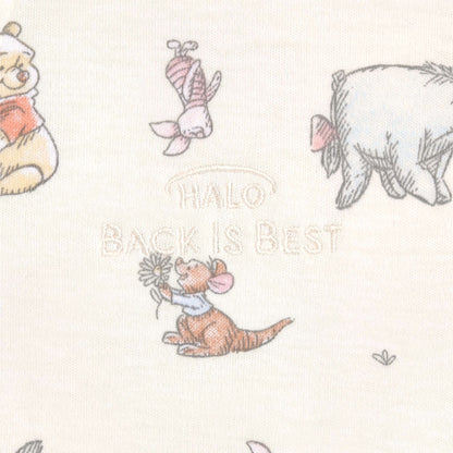 Close-up of HALO® SleepSack® fabric showing the "Back is Best" embroidery with Winnie the Pooh characters, a safety reminder for proper baby positioning.