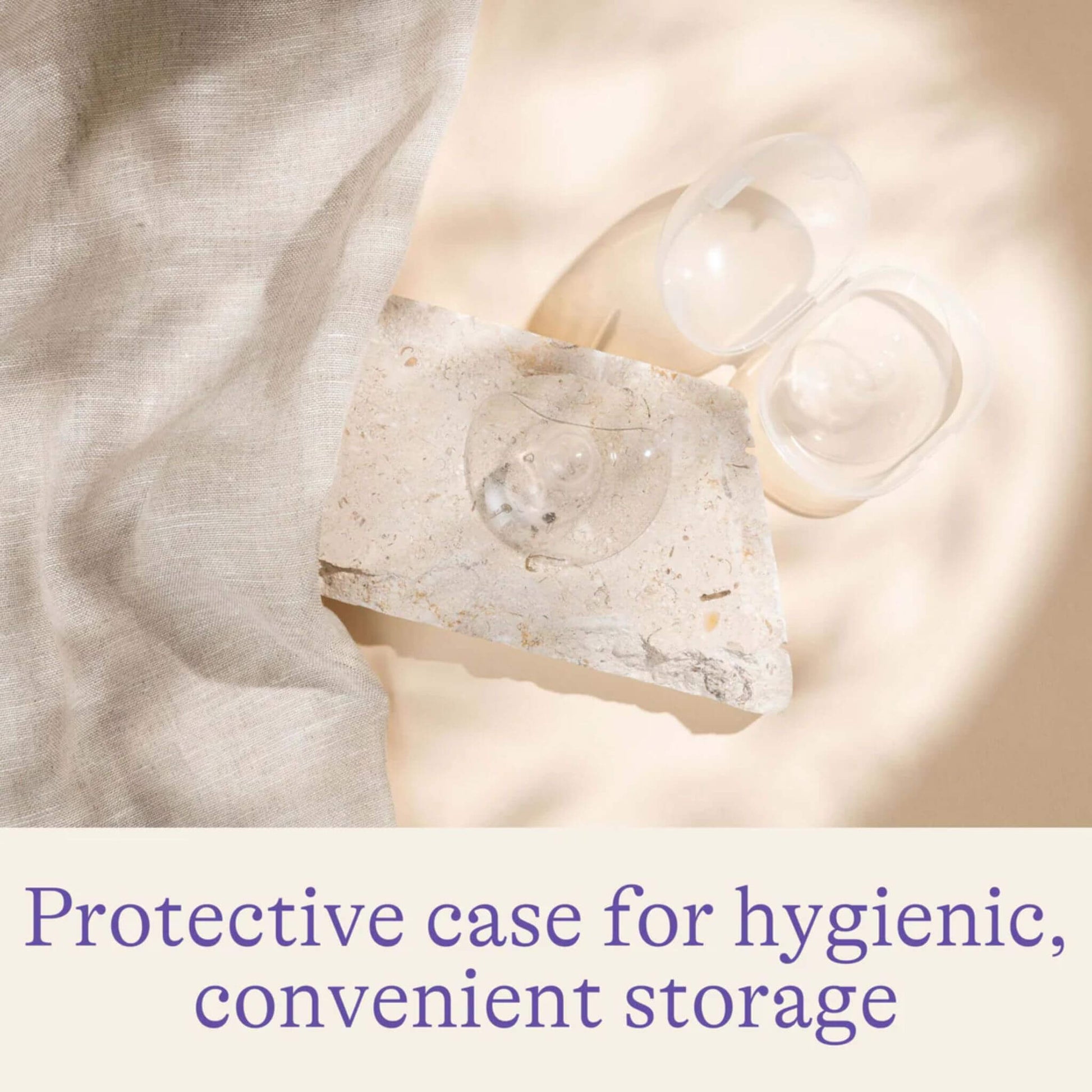 Lansinoh Contact Nipple Shield placed on a stone surface next to its protective case, emphasising the hygienic and convenient storage solution.






