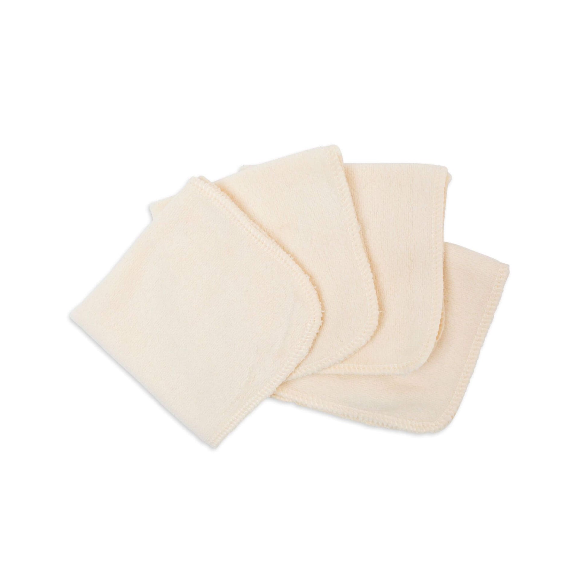 Lulujo Organic Face Cloths fanned out to display the natural undyed cotton texture and quality craftsmanship.