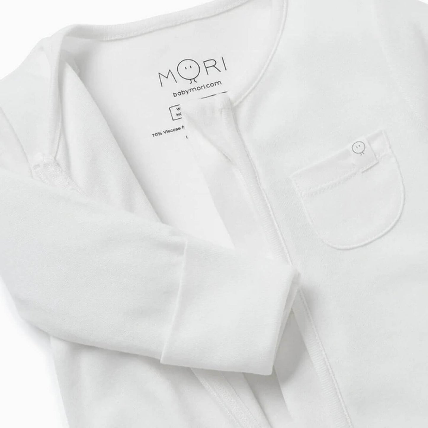 MORI Clever Zip Sleepsuit in white, featuring a front two-way zip for easy changing, long sleeves, footed design, and a small white chest pocket.