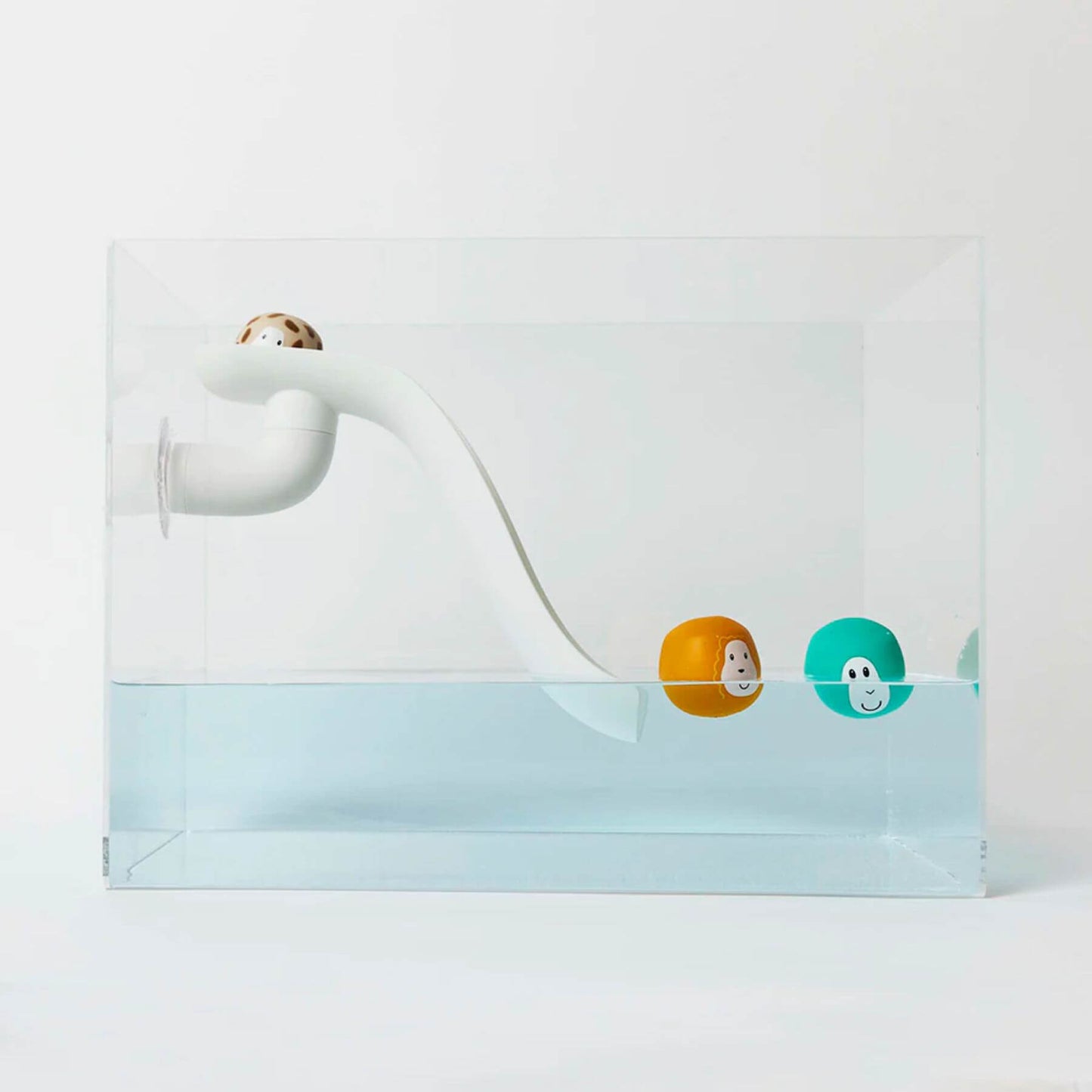 White Matchstick Monkey slide set attached to the side of a transparent bath with three floating animal rocks, ideal for water play