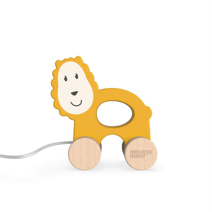 Matchstick Monkey wooden pull-along toy featuring a cute, smiling lion design with natural wooden wheels, perfect for toddlers."