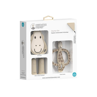 Matchstick Monkey gigi giraffe teething starter set in packaging, featuring a flat teether, animal teether, and silicone finger toothbrushes with antimicrobial technology.