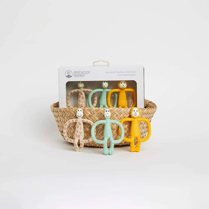 Matchstick Monkey animal teether gift set in a woven basket, featuring giraffe, monkey, and lion teethers with antimicrobial protection, ideal for soothing gums.