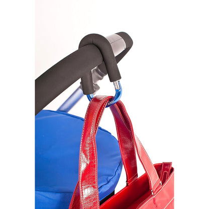 Sturdy blue buggy clip securely holding a red bag on a pram, providing a practical solution for hands-free carrying while on the move.