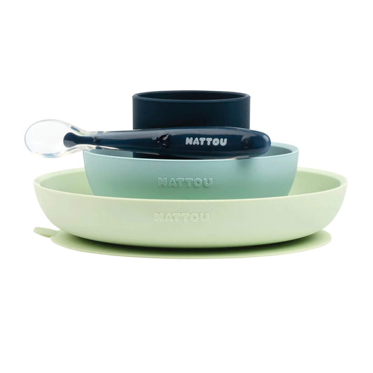 Nattou tableware set, featuring a non-slip plate, bowl, cup, and a silicone spoon, perfect for baby-led weaning and easy, mess-free feeding.