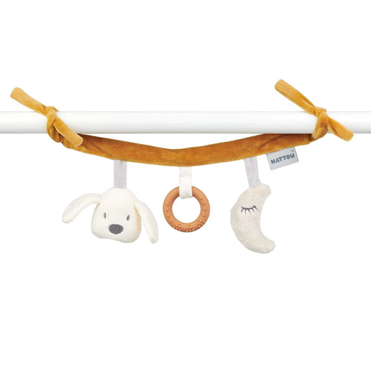 Nattou Charlie the Dog Maxi Toy featuring a soft dog head, teething ring, and plush moon, easily attaches to pram for on-the-go fun.