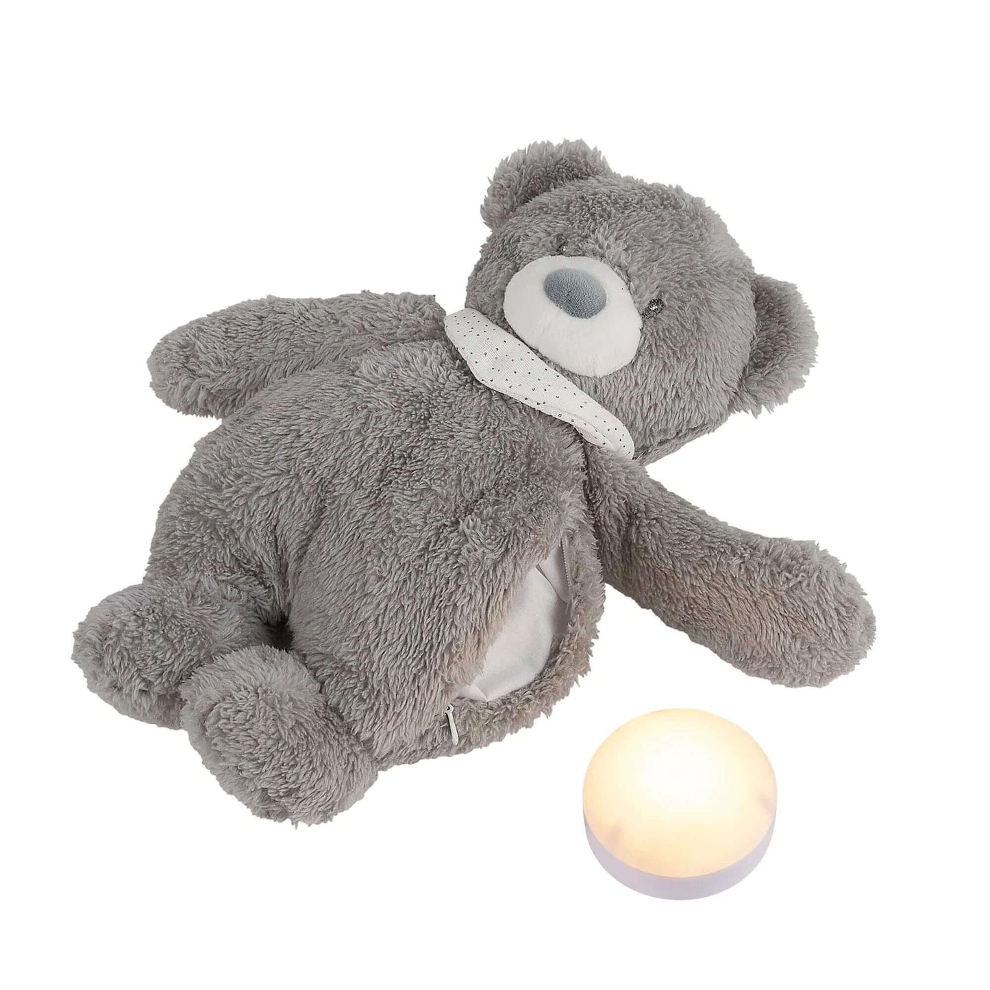 Grey Nattou Sleepy cuddly bear nightlight with soft fur, shown lying down next to a glowing round nightlight. Ideal for comforting and soothing babies.