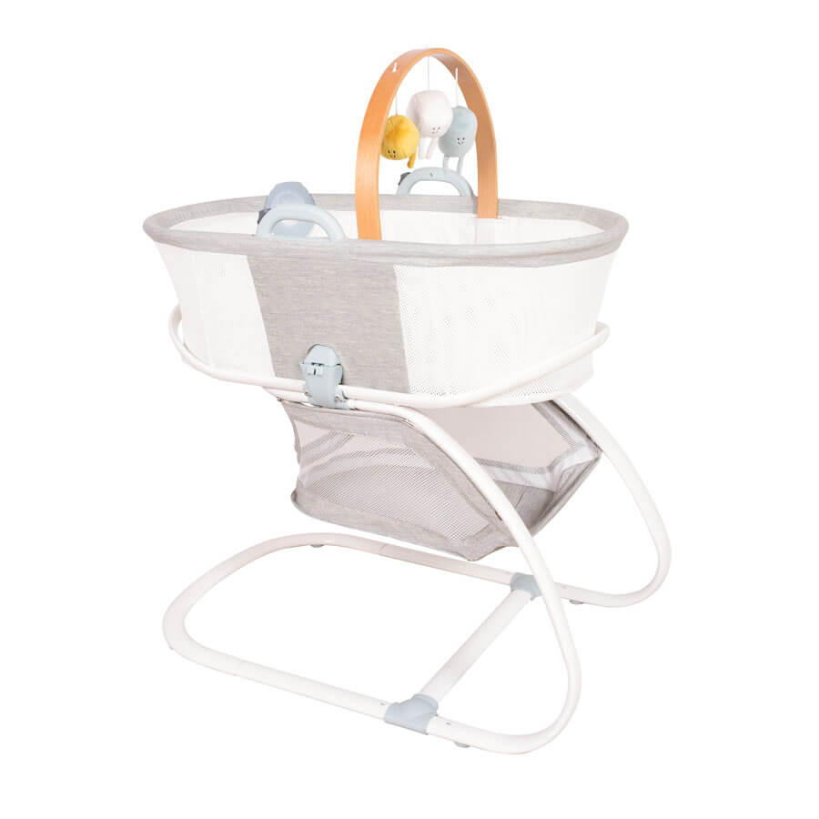 Purflo breathable crib with mesh sides for airflow, modern design, and sturdy white frame. Features a handy storage shelf and a mobile arch.