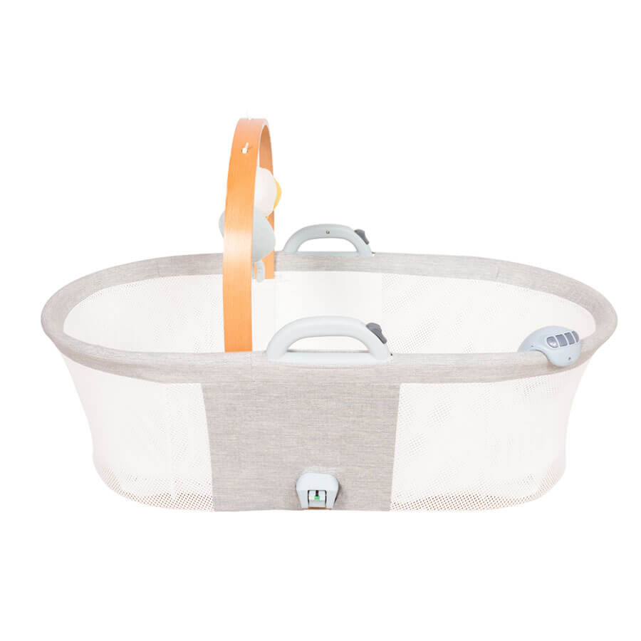 Top view of Purflo breathable crib, highlighting mesh sides for airflow, two carry handles, soft grey fabric, and a wooden mobile arch with hanging toys.