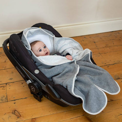 Soft  travel blanket designed to keep babies cosy in car seats and prams. The Purflo Cosy Wrap provides warmth and comfort, with easy-to-use fastenings and breathable fabric.