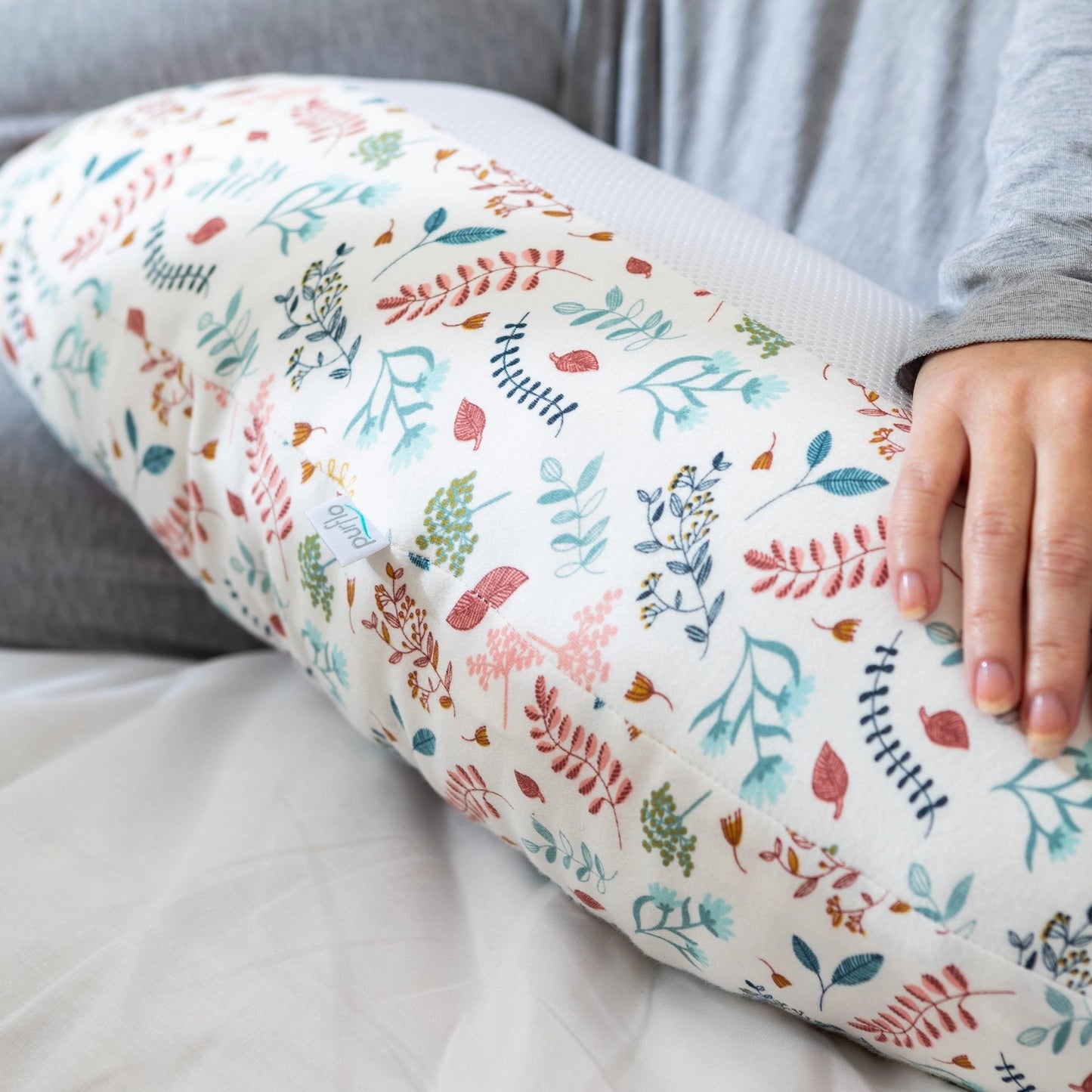 Close-up of Purflo Breathe Pregnancy Pillow in Botanical print, showcasing soft fabric and breathable mesh.