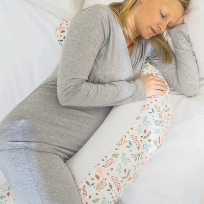 Pregnant woman sleeping with the Purflo Breathe Pregnancy Pillow in Botanical print, offering full-body support and comfort for side sleeping.