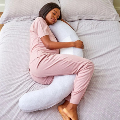 Woman sleeping comfortably with the Purflo Breathe Pregnancy Pillow in minimal grey, featuring ergonomic support and breathable fabric.