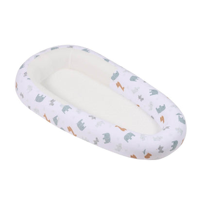 Purflo Sleeptight Baby Bed in Animal Safari print, with a white cover featuring elephants and giraffes. Offers a soft, breathable, and secure sleeping space for baby.