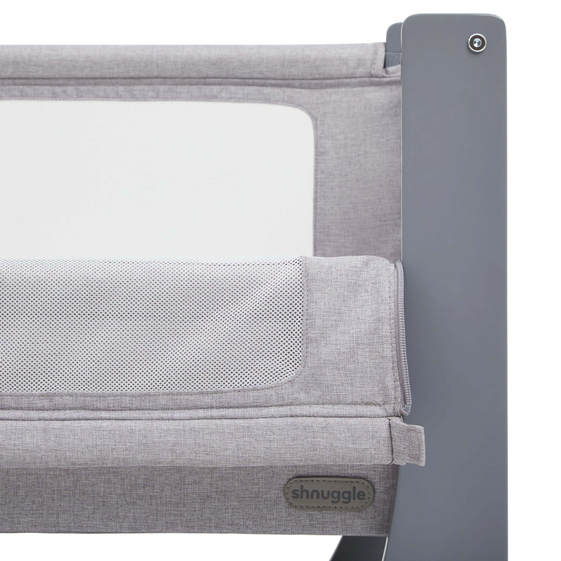 Close-up of Shnuggle Air Lite Bedside Crib, featuring breathable mesh panel and sturdy frame for safe, comfortable infant sleep.