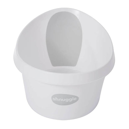 White Shnuggle toddler bath with supportive grey backrest and high sides, designed for comfort and safety. Shnuggle logo on front.