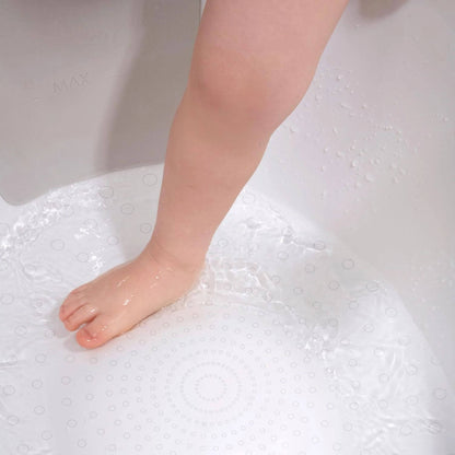 Close-up of a toddler's foot stepping into the Shnuggle bath, showing textured, non-slip surface for added grip and safety.