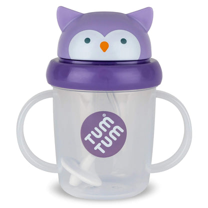 A clear TUM TUM Tippy Up Cup, featuring a cute owl lid with handles on both sides for easy gripping. The cup includes a weighted straw that follows the liquid, allowing toddlers to drink comfortably from any angle.