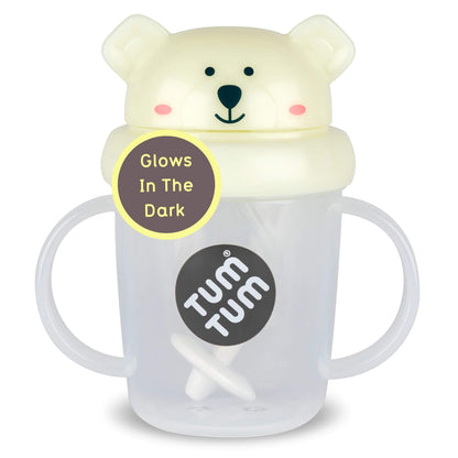 A clear TUM TUM Tippy Up Cup. Featuring a Pete Polar Bear lid with handles on both sides for easy gripping. The cup includes a weighted straw that follows the liquid, allowing toddlers to drink comfortably from any angle.