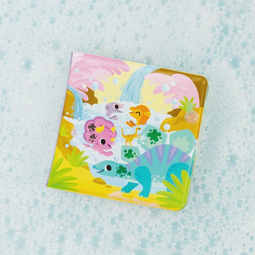 Tiger Tribe Messy Dinosaurs Bath Book submerged in bubbly water, featuring colourful dinosaurs that change with temperature for interactive bath play.