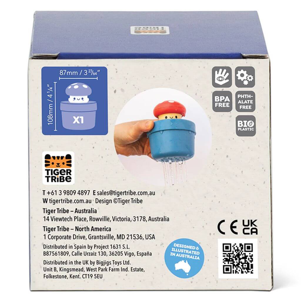 Back of the Tiger Tribe pop-up mushroom toy packaging showing dimensions (108 mm height, 87 mm width), eco-friendly features, and safety certifications.