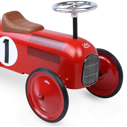 Close-up of the Vilac Classic Metal Car in red, featuring a brown seat, silver steering wheel, and number 1 detail, showcasing its retro design.