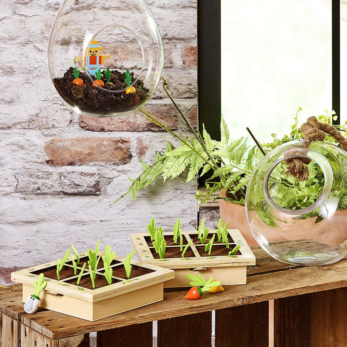 Lifestyle image of the Vilac Vegetable Gardener's Battleship Game displayed with wooden grids, colourful vegetables, and a charming garden setting.