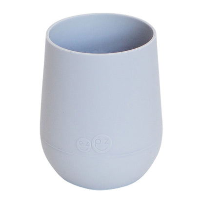 The Ezpz Mini Cup is designed to fit a toddler's mouth and hands. The cup's soft silicone protects developing teeth and gums, and the non-slip silicone grip makes movements to the mouth more successful.