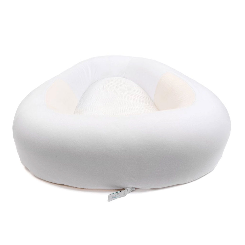 Purflo Sleeptight Baby Bed with a white cover. Provides a secure and breathable sleep area.