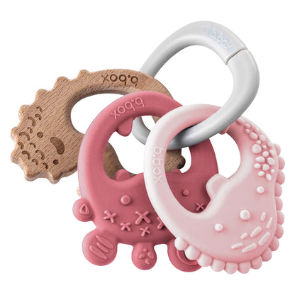 Designed to grow with baby the b.box trio teether has three textured teethers on one handy ring offering the choice of silicone and beechwood throughout the teething journey.  Lightweight and easy to hold, use individually or as a set with customisable ring attachment to provide relief to sore, achy gums and stimulate sensory development.